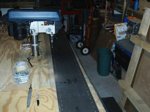 Left spar web being drilled