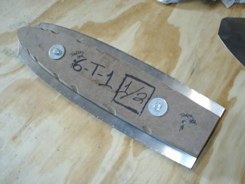 Blank clamped into forming block ready to be bent