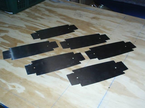 Part blanks cut out with a router using cutting blocks