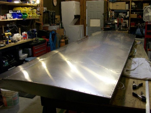 From the aft outboard corner (aileron mount)