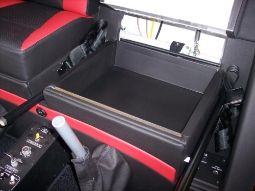 Seat pan coated with bed liner.