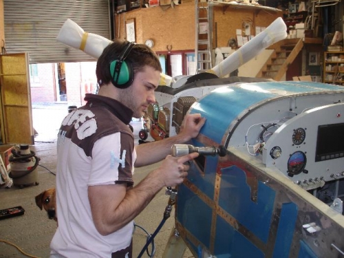 My son luke helping shoot the last few rivets that I couldnt manage on my own