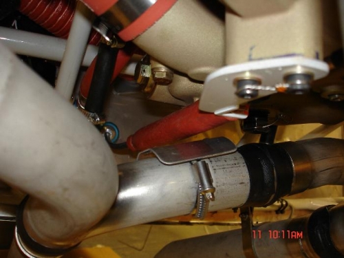 Fit heat shield to protect throttle cable