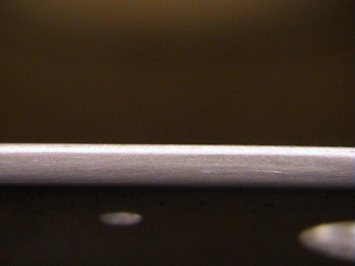 This is that same edge after polishing on the scotchbrite wheel.