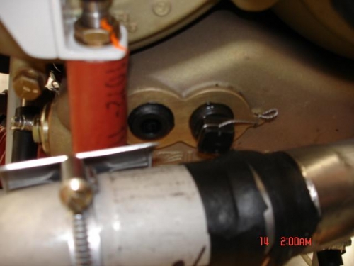 Drain plug directly above exhaust (the amalg tape is an attempt to keep moisture out the engine.