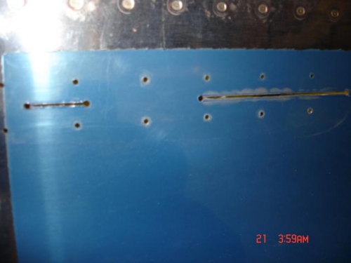 I used a cut off wheel to join the holes