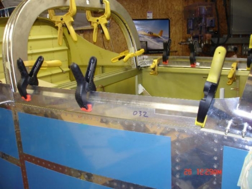 Checking the fit of the side rails with the side of the fuse using a scrap peice of alli