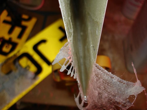 An old hacksaw blade gets it right into the tip