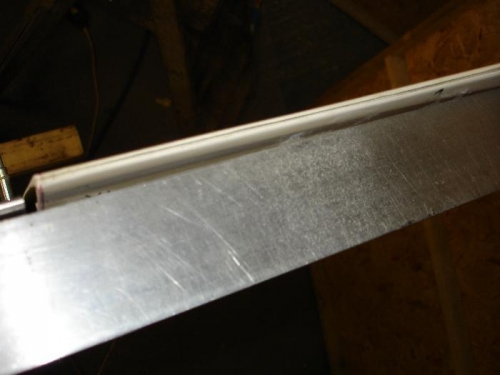 Straight edge shows amount of twist that needs removing