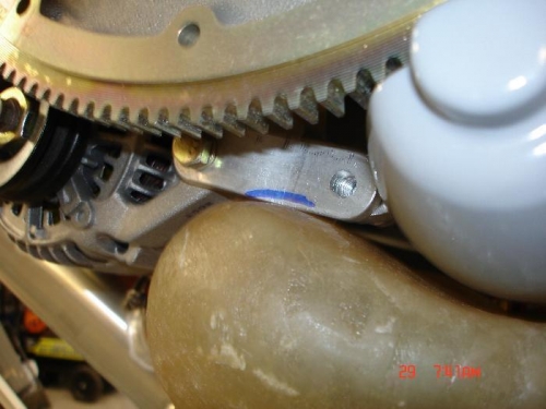 Interference issue with bottom alternator strap and boss