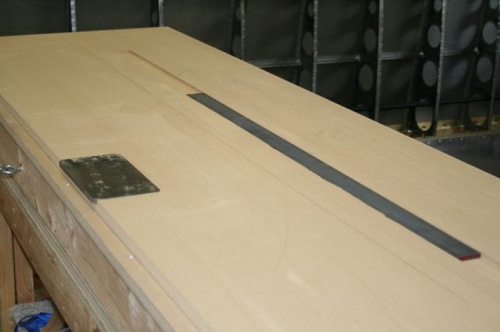 Routed table with inlayed back rivet plates
