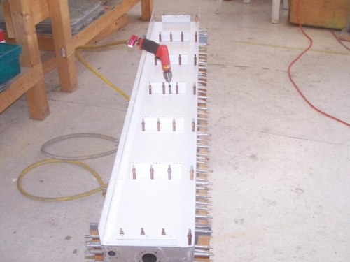 Final drilling the tank baffle and zees to the spar rear flanges.