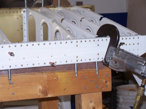 Riveting on the W-1007B,C  reinforcement plates to the rear spar.