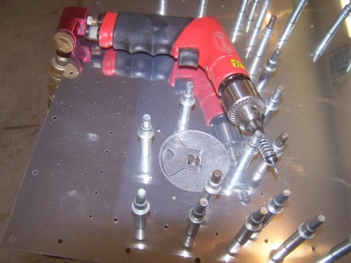 Match drilling the fuel cap flanges to the skins.