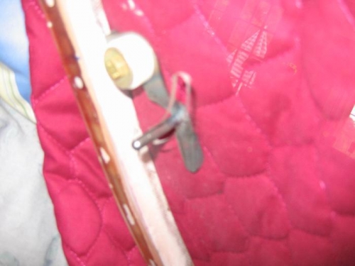 Slot with pin and catch