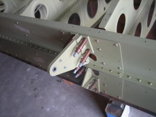Aileron bracket being installed