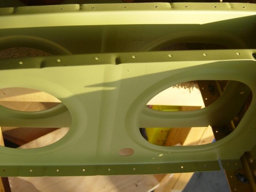 Inboard rib with hole drilled for the wiring bundle conduit