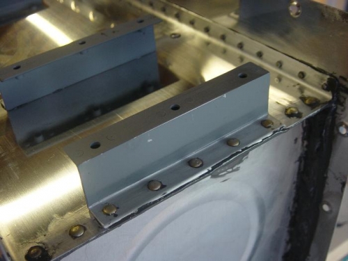 Solid rivets in the end rib/baffle/z bracket