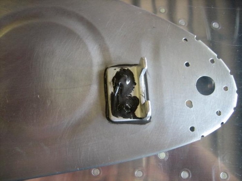 Flop tube antirotation bracket