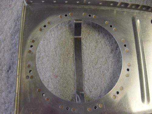 Inboard rib inspection hole cut with stiffening ring installed