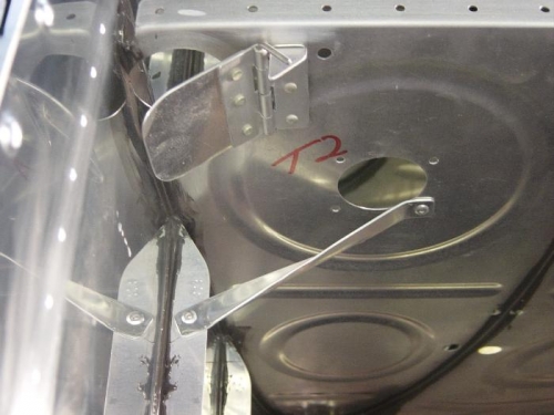 Antihang brackets for inspect hole and outbd side of bay one