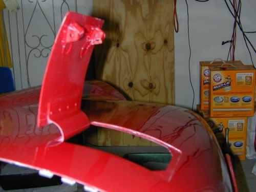 Oil door latch/hinge arrangement