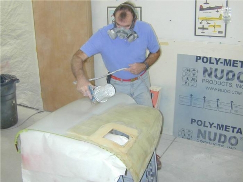 John applying first coat of primer-filler to top cowl