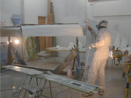 Epoxy primer being applied to flaps