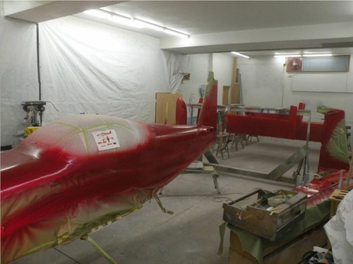 Wings, tail and fuselage in red.