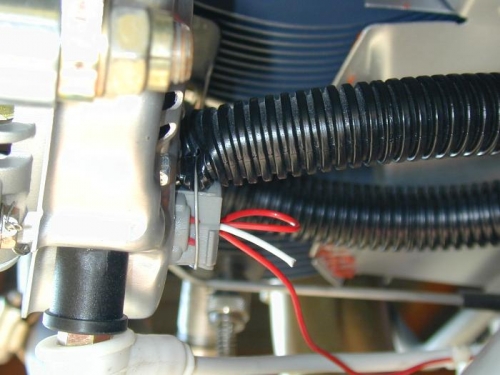 Use of safety wire to hold end of tube to back of alternator