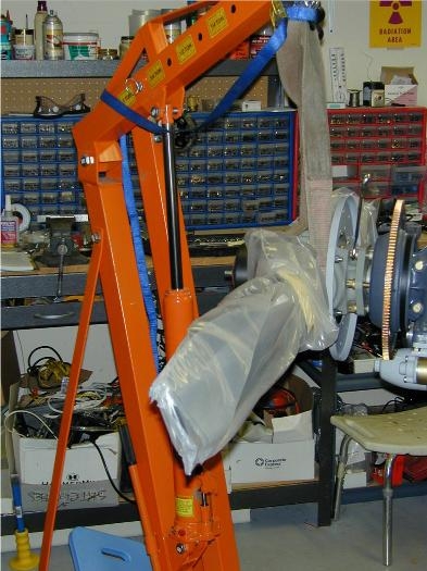Engine hoist holding prop while bolting to crank