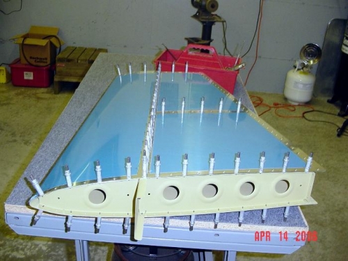 Skin clecoed on frame.