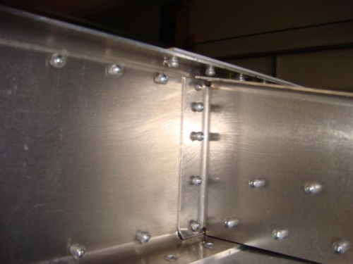 Shows edge distance issue at top of gusset flange.