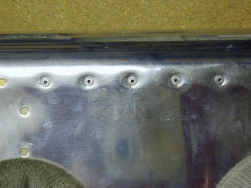 pop rivets leave a crappy finish,  good thing they are on the bottom