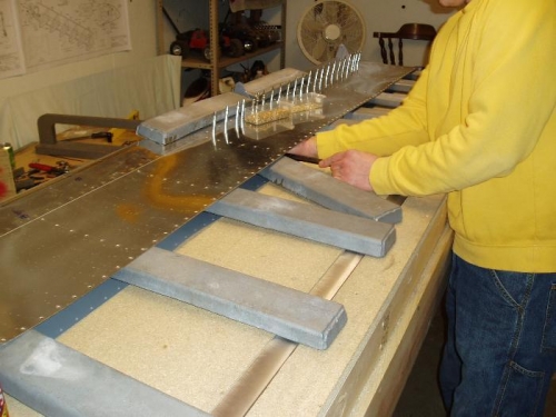 riveting bottom skin to spar