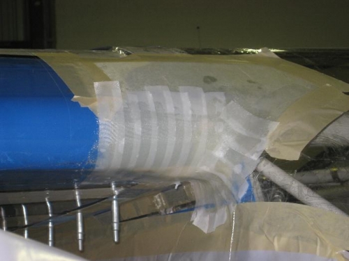 Fiberglass work on the wing fairing.