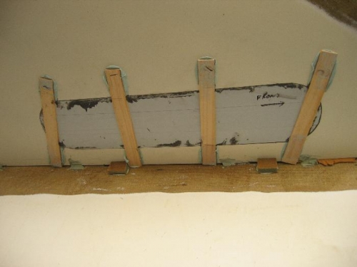 Paint sticks holding plexi in place