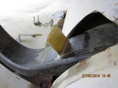 Tab for holding upper gear door
