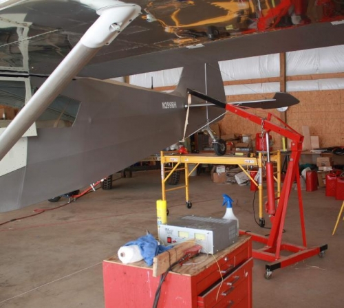 Regulated power supply, engine lift, gas can and digital scale.