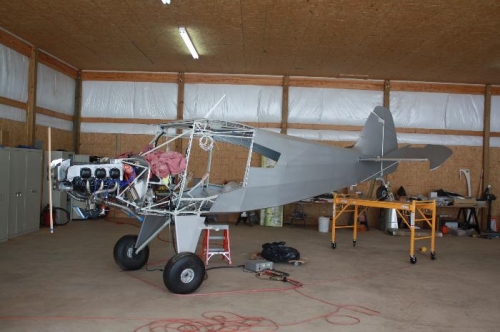 Scaffold to raise tail and level aircraft,