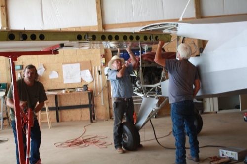 Cranking up the drywall lift.