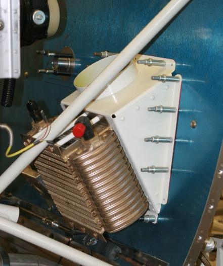 Oil cooler mounted on firewall.