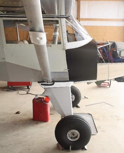 Leading edge 1.94 inches aft of main gear.