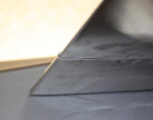 Bend radius slightly larger than wing root.