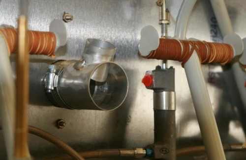 Heat Box outlet with defroster takeoff.