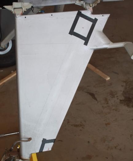 Fabric tears bordered by tape.