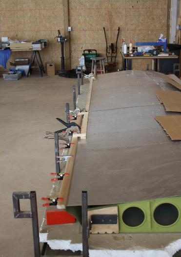 Applying poplar edge protectors.