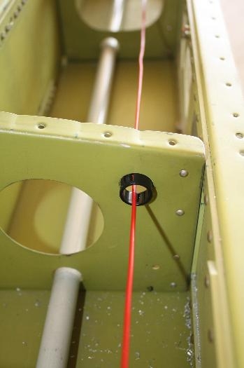 Plastic bushing to protect cable.