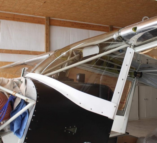 Protective covering, side frames and lower fairing installed.