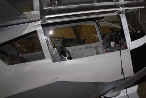 Right front door mounted, window in up position.